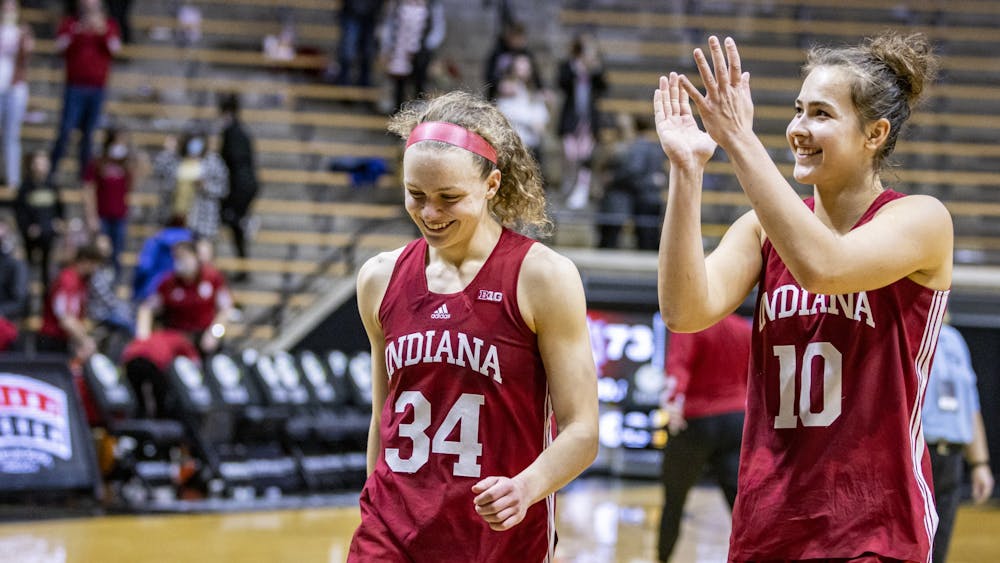 Senior guard Grace Berger and senior forward Aleksa Gulbe walk off the court after Indiana&#x27;s 73-68 win against Purdue on Jan. 16, 2022, at Mackey Arena in West Lafayette, Indiana. Berger scored 24 points and Gulbe scored 21 points.