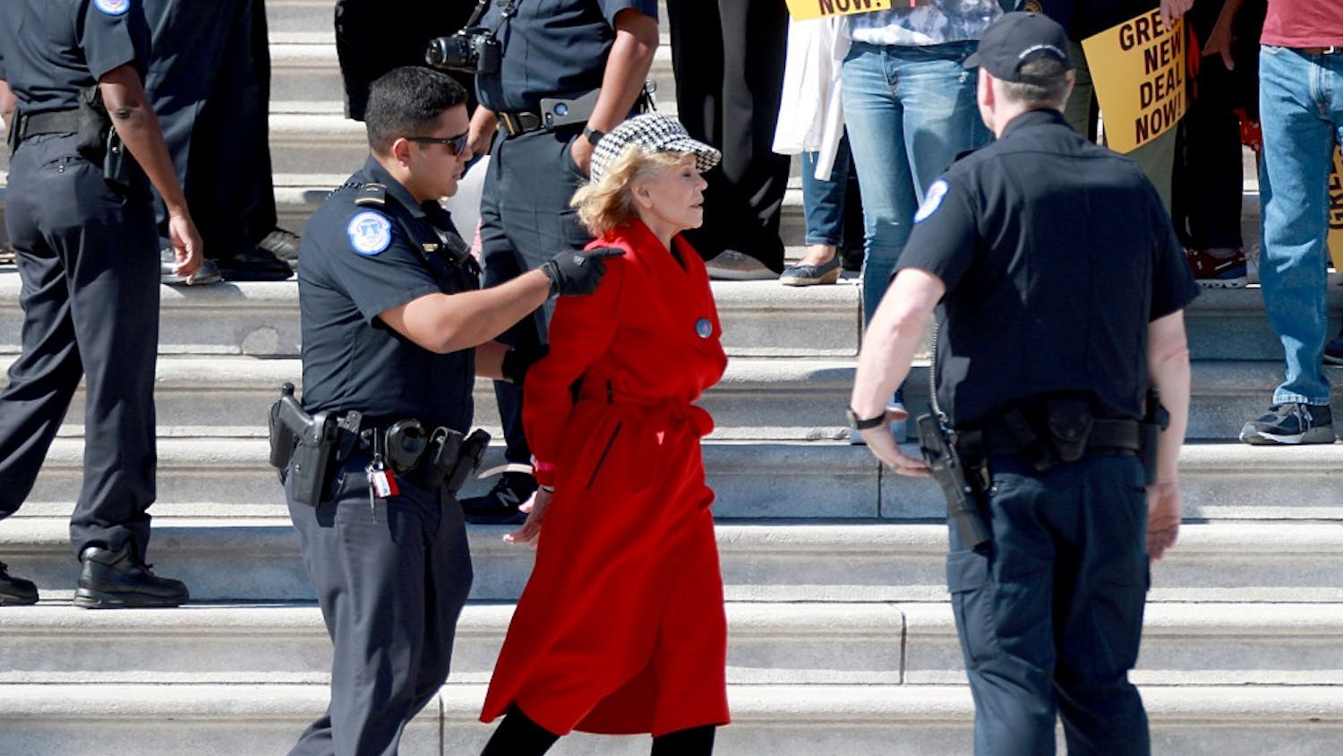 Actress Jane Fonda is arrested for blocking a street in front of the U.S. Capitol on Oct. 18 during a climate change protest and rally on Capitol Hill, in Washington, D.C. Protesters are demanding urgent action on adapting the Green New Deal, implementing clean, renewable energy, and ending all new fossil fuel exploration and drilling.