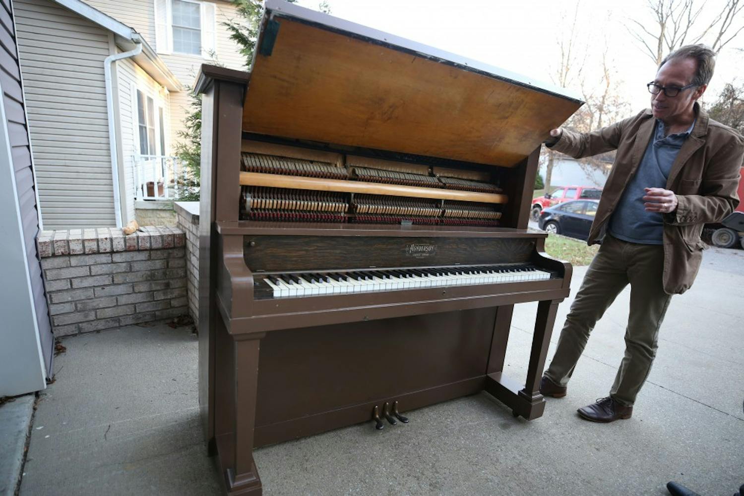 Jon Vickers, founding director of IU Cinema, stands next to the 1916 Henderson Piano that will be burnt Feb. 7 in Dunn Meadow. This performance will be free and open to the public.&nbsp;