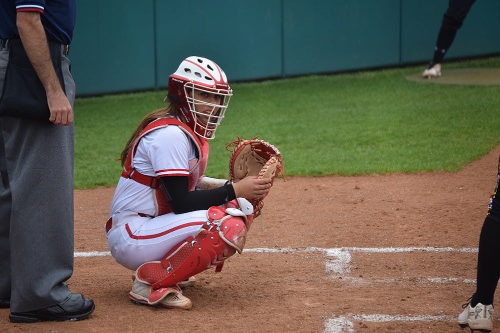 Freshman catcher Bella Norton looks to the dugout to see what pitch to call on Friday, April 21, 2017. The Hoosiers defeated the Terrapins in all three games in Bloomington.