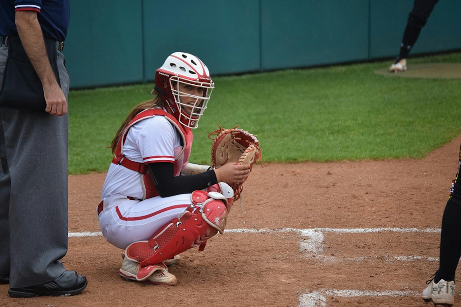 Freshman catcher Bella Norton looks to the dugout to see what pitch to call on Friday, April 21, 2017. The Hoosiers defeated the Terrapins in all three games in Bloomington.
