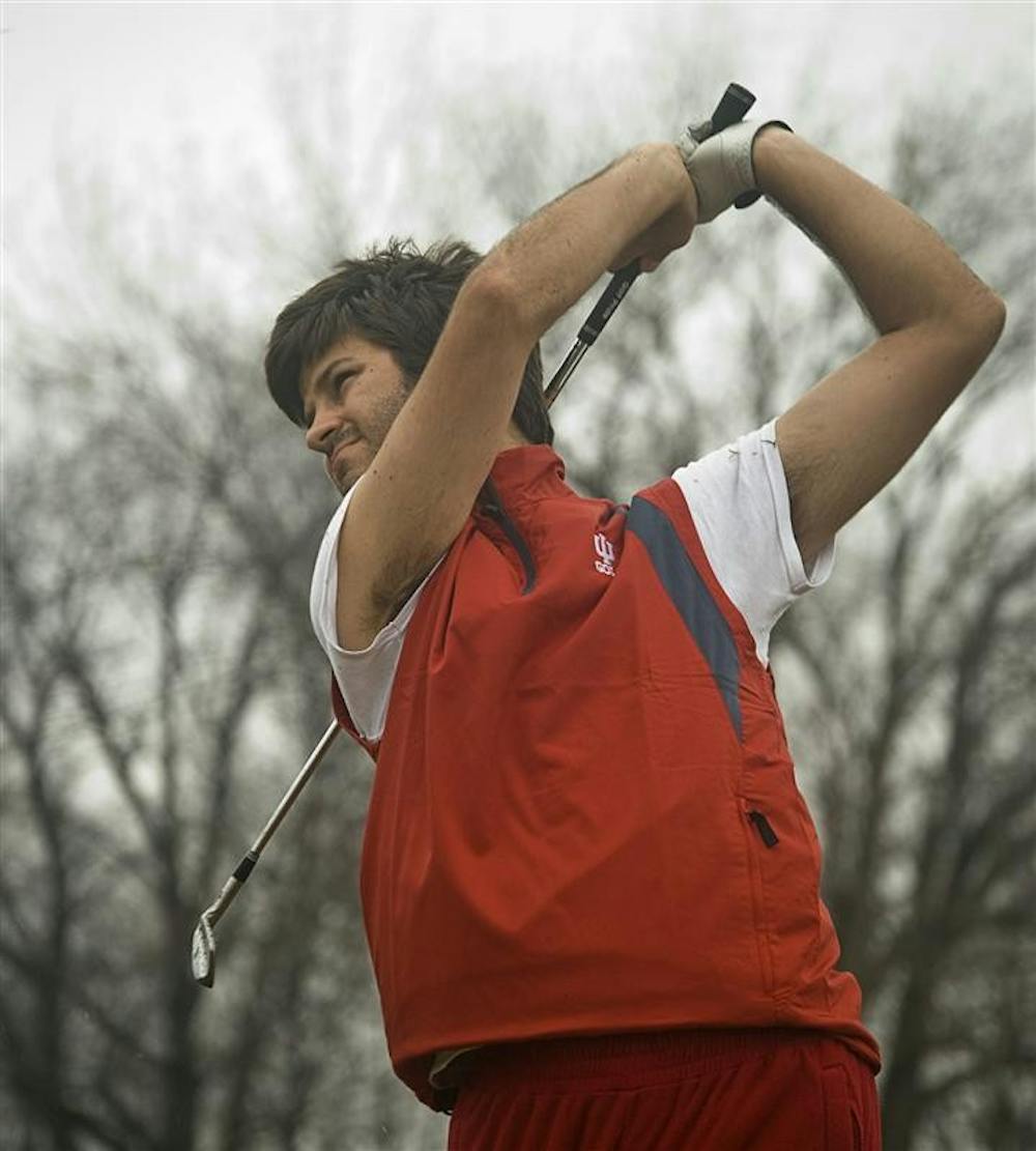 Senior Jorge Campillo tracks his shot during practice Feb. 26 at the IU golf course's driving range. The Hoosiers travel to San Diego for the College Match Play Championship on March 22.