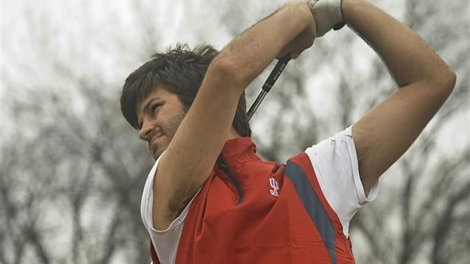 Senior Jorge Campillo tracks his shot during practice Feb. 26 at the IU golf course's driving range. The Hoosiers travel to San Diego for the College Match Play Championship on March 22.