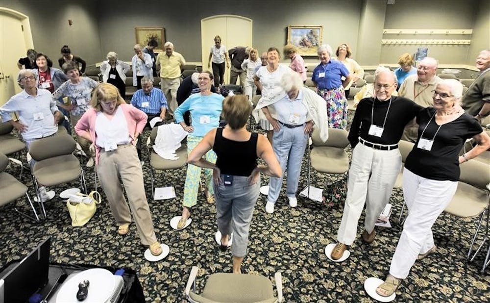 Carol Kennedy-Armbruster leads Mini University participants June 2007 in Target Fitness: Functional Exercise for Adults in the State Room East of the Indiana Memorial Union.