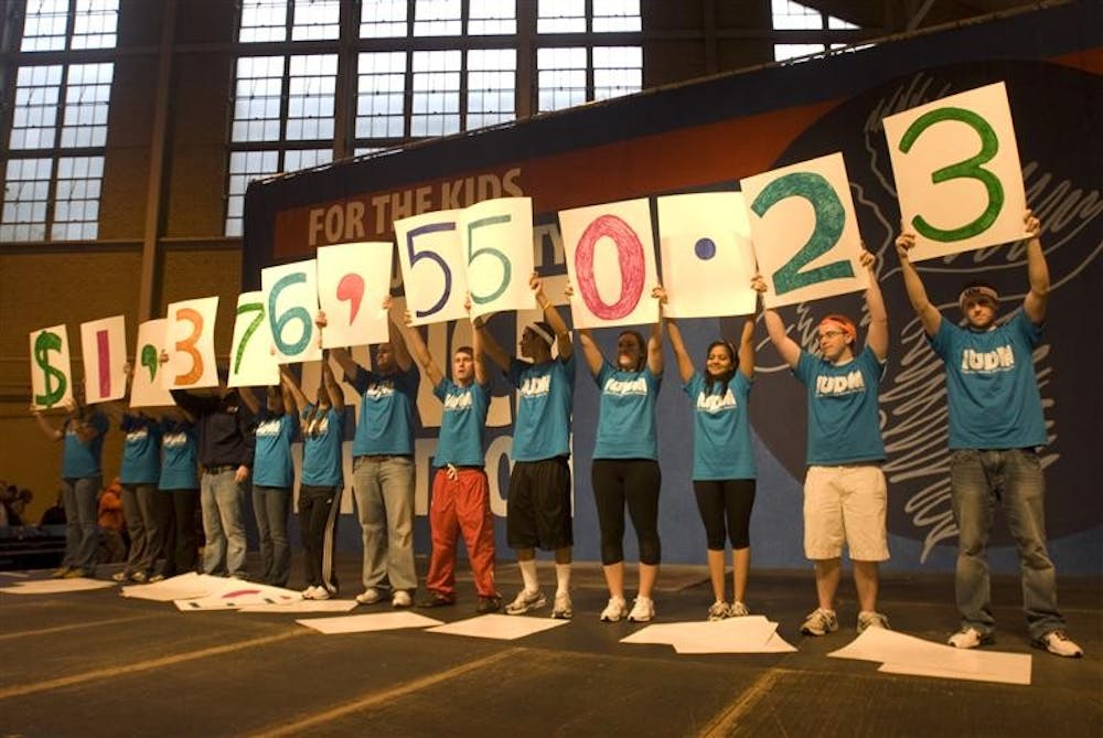 Participants of the IU Dance Marathon reveal how much the fundraiser earned for Riley Hospital in the HPER at about 8 a.m. Sunday. The dancers had stayed awake dancing and standing for 36 hours by this point.