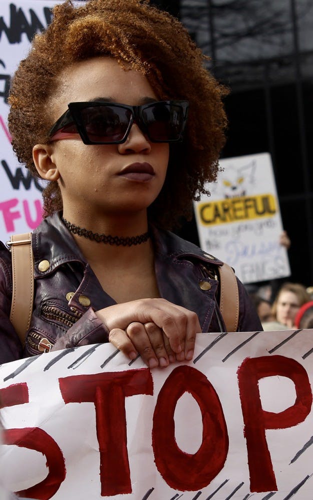 &nbsp;Paeton Chavis, 24, holds a sign during the Women's March in Indianapolis on Saturday afternoon.&nbsp;