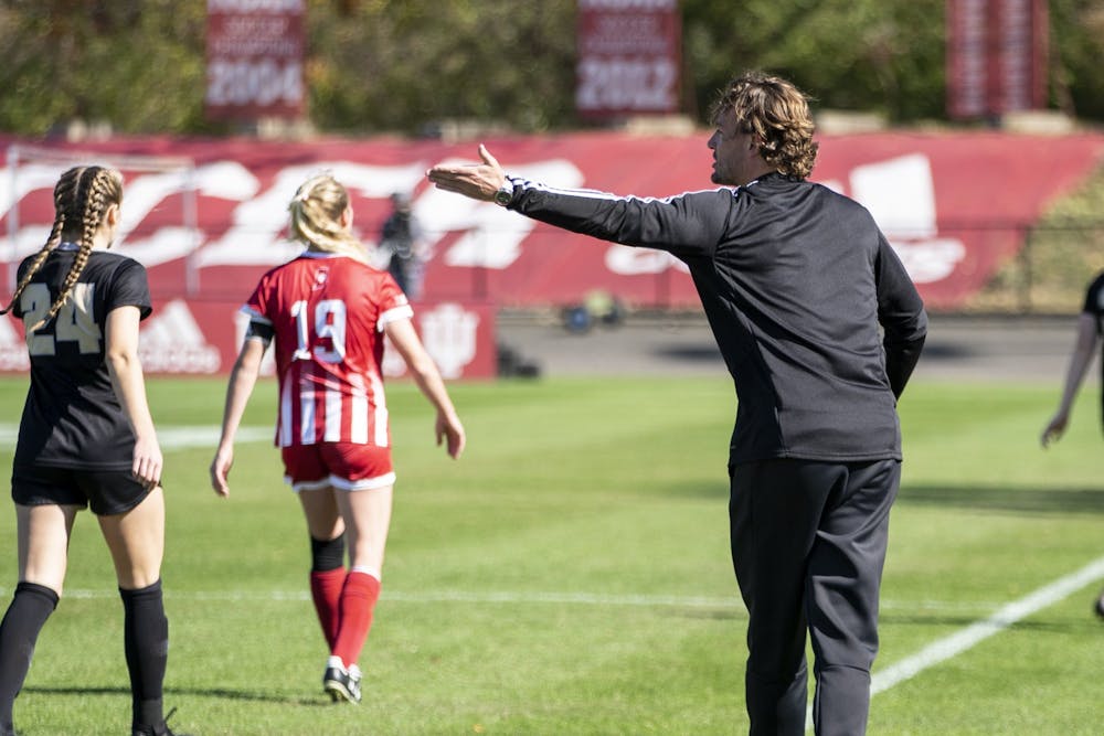 <p>Indiana women&#x27;s soccer head ﻿coach Erwin van Bennekom gives advice to a player Oct. 27, 2019, at Bill Armstrong Stadium. Van Bennekom and Indiana softball head coach Shonda Stanton signed extensions to lead their respective programs through 2027.</p>
