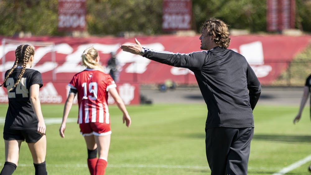 Indiana women&#x27;s soccer head ﻿coach Erwin van Bennekom gives advice to a player Oct. 27, 2019, at Bill Armstrong Stadium. Van Bennekom and Indiana softball head coach Shonda Stanton signed extensions to lead their respective programs through 2027.