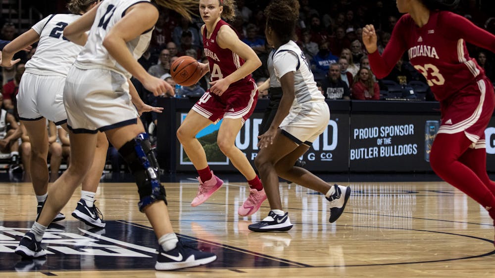 IU senior guard Grace Berger dribbles as sophomore forward Kiandra Brown cuts toward the basket against Butler University on Nov. 10, 2021, at Hinkle Fieldhouse. Indiana plays NC State on Thursday in a rematch of last year’s Sweet 16.