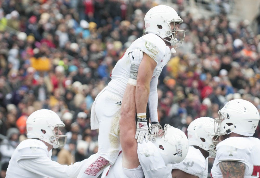 Offensive lineman Dan Feeney lifts wide receiver Mitchell Paige after Paige scored against Purdue on Nov. 28, 2015 at Ross-Ade Stadium. The Hoosiers won 54-36.