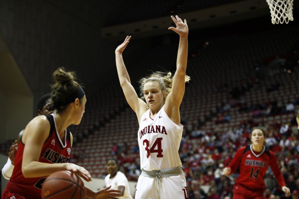 <p>Freshman Grace Berger puts her arms up in order to stop a shot Nov. 25 in Simon Skjodt Assembly Hall. IU beat Northern Illinois University, 91-73.&nbsp;</p>