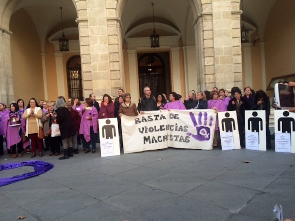 Activists protest against domestic violence in Seville's Plaza Nueva.