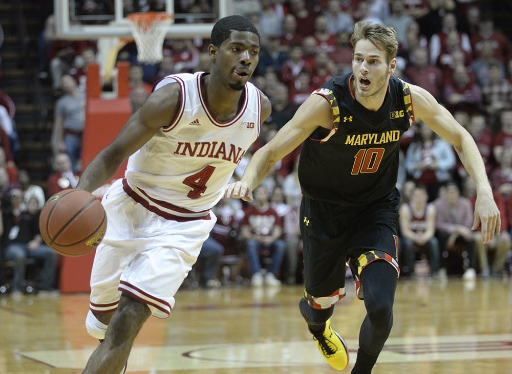 Freshman Rob Johnson dribbles past his defender during IU's game against Maryland on Thursday at Assembly Hall.