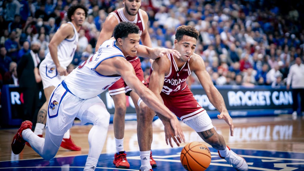Senior forward Trayce Jackson-Davis turns the ball over Dec. 10, 2022 at the Allen Fieldhouse in Lawrence, Kansas. The Hoosiers lost to Kansas 84-62.