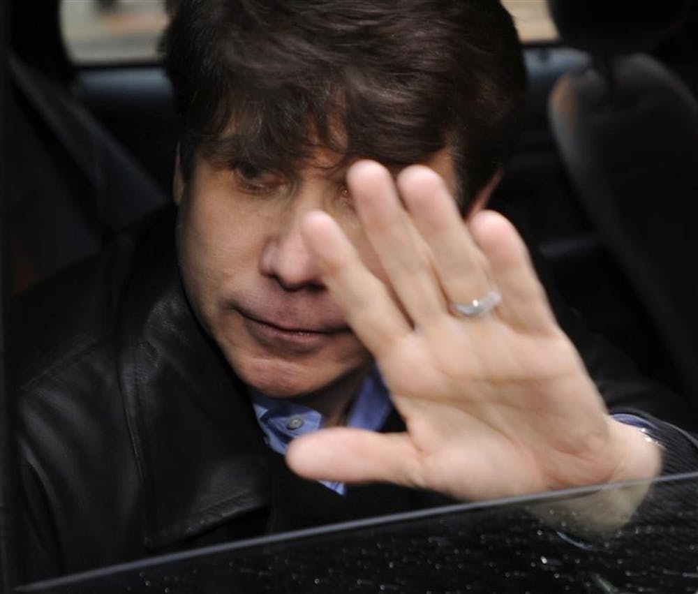 Illinois Gov. Rod Blagojevich leaves a downtown building where a high profile defense attorney has an office Saturday in Chicago. Blagojevich was arrested this week on federal charges that he tried to sell President-elect Barack Obama's vacant Senate seat.