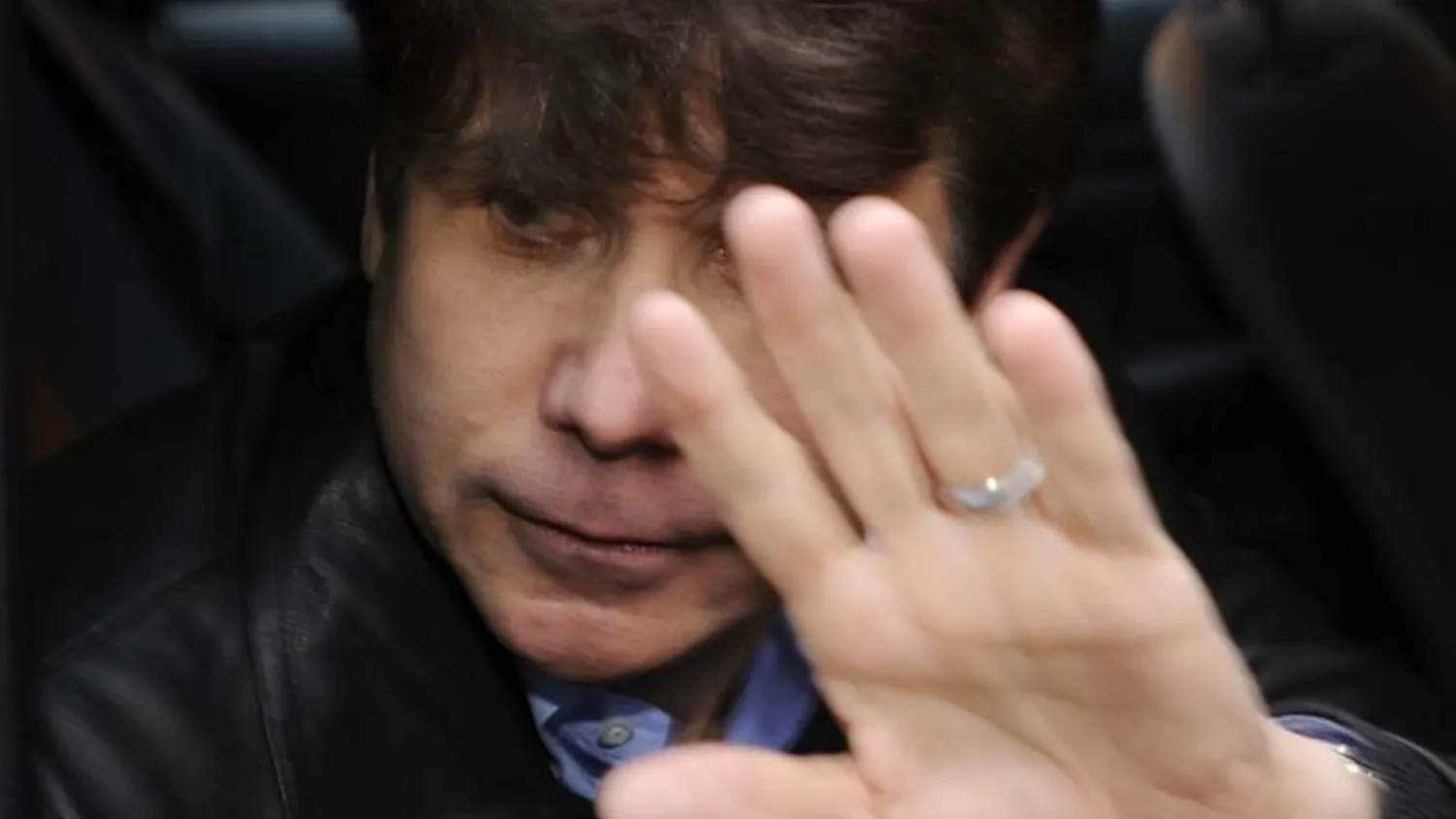 Illinois Gov. Rod Blagojevich leaves a downtown building where a high profile defense attorney has an office Saturday in Chicago. Blagojevich was arrested this week on federal charges that he tried to sell President-elect Barack Obama's vacant Senate seat.