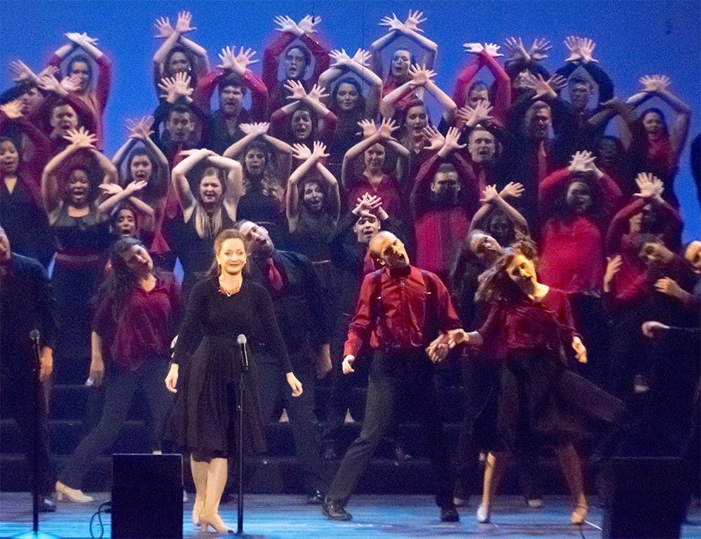 Members of the IU Singing Hoosiers perform Saturday at the IU Auditorium. Student singers and instrumentalists from the IU Jacobs School of Music sing and dance every Spring Concert annually. 