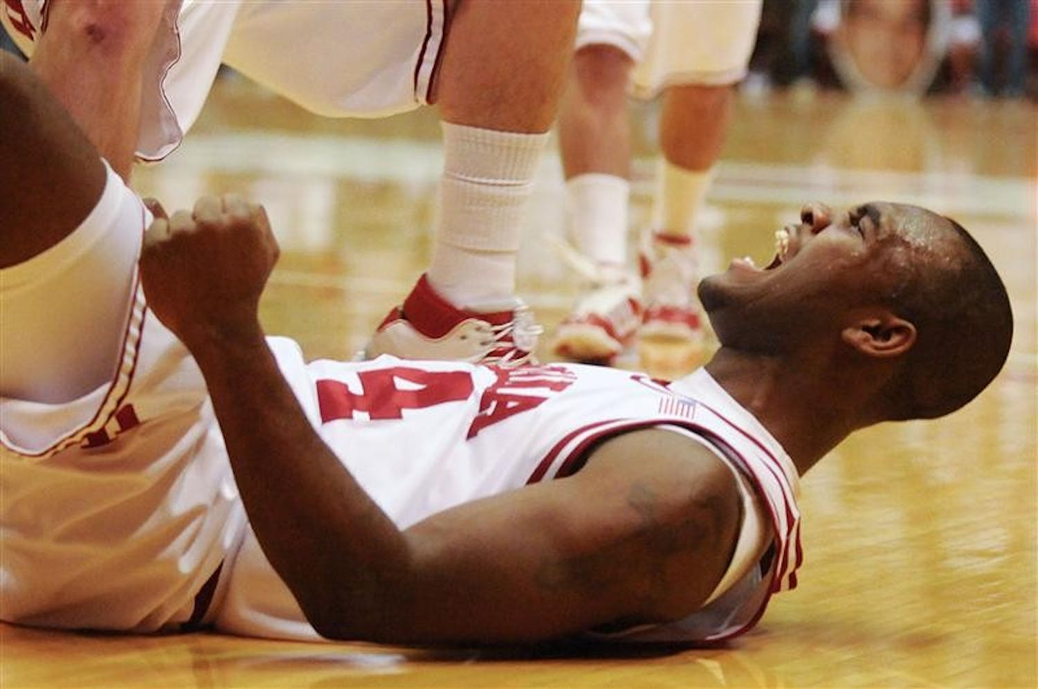 IU's Malik Story celebrates from the floor after he was fouled while shooting late in IU's 67-63 loss to No. 21 Minnesota on Jan. 25 at Assembly Hall. Story had 14 points off the bench.