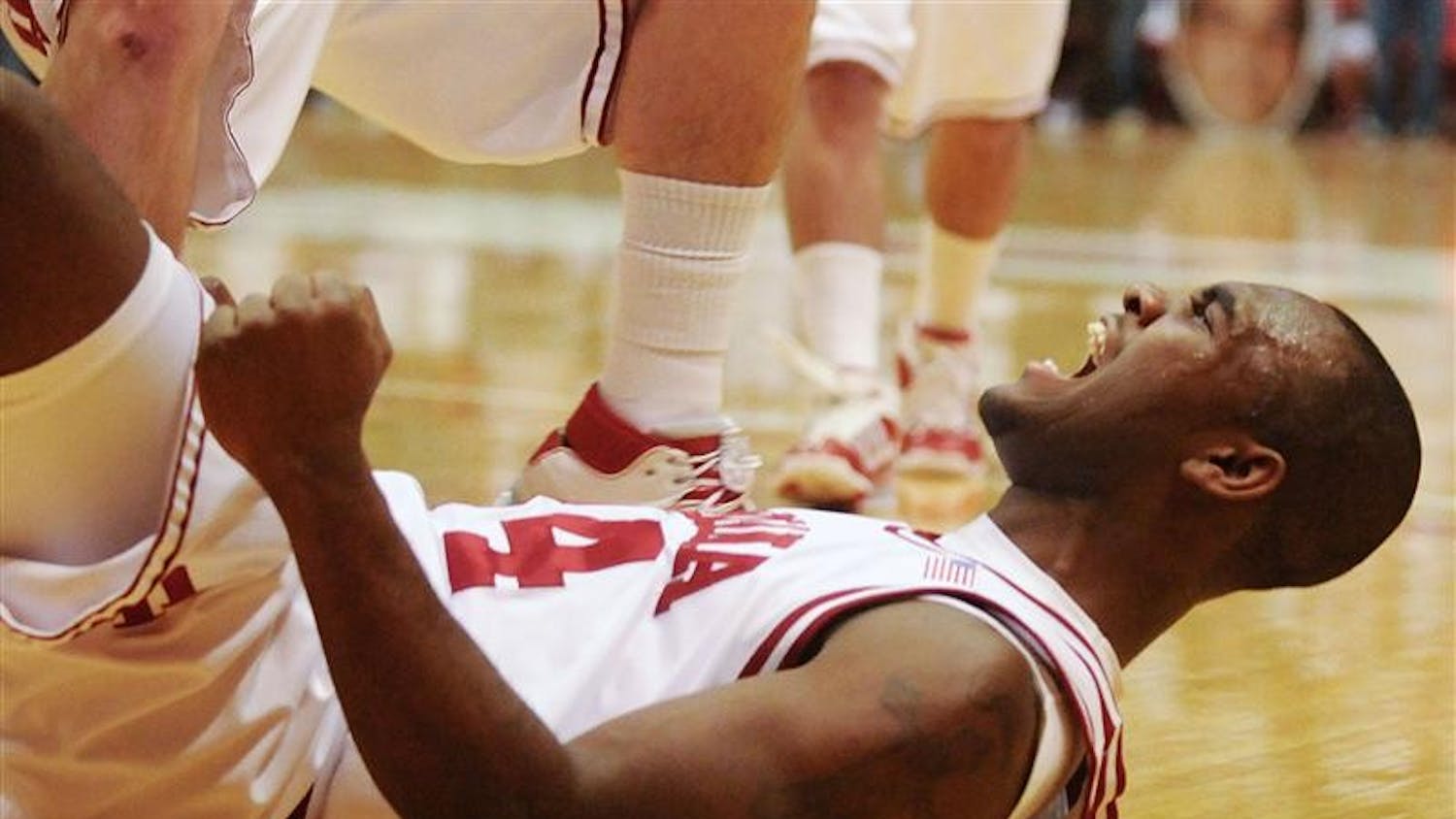 IU's Malik Story celebrates from the floor after he was fouled while shooting late in IU's 67-63 loss to No. 21 Minnesota on Jan. 25 at Assembly Hall. Story had 14 points off the bench.