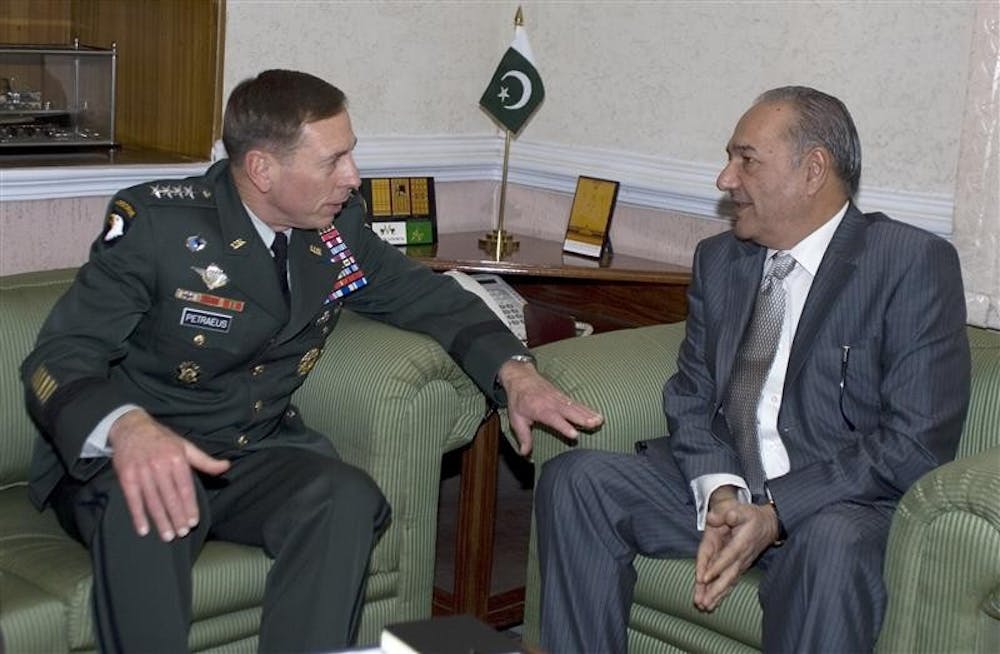 U.S. Central Command Gen. David Petraeus, left, talks with Pakistan's Defense Minister Chaudhry Ahmed Mukhtar during a meeting in Rawalpindi, Pakistan, Monday.