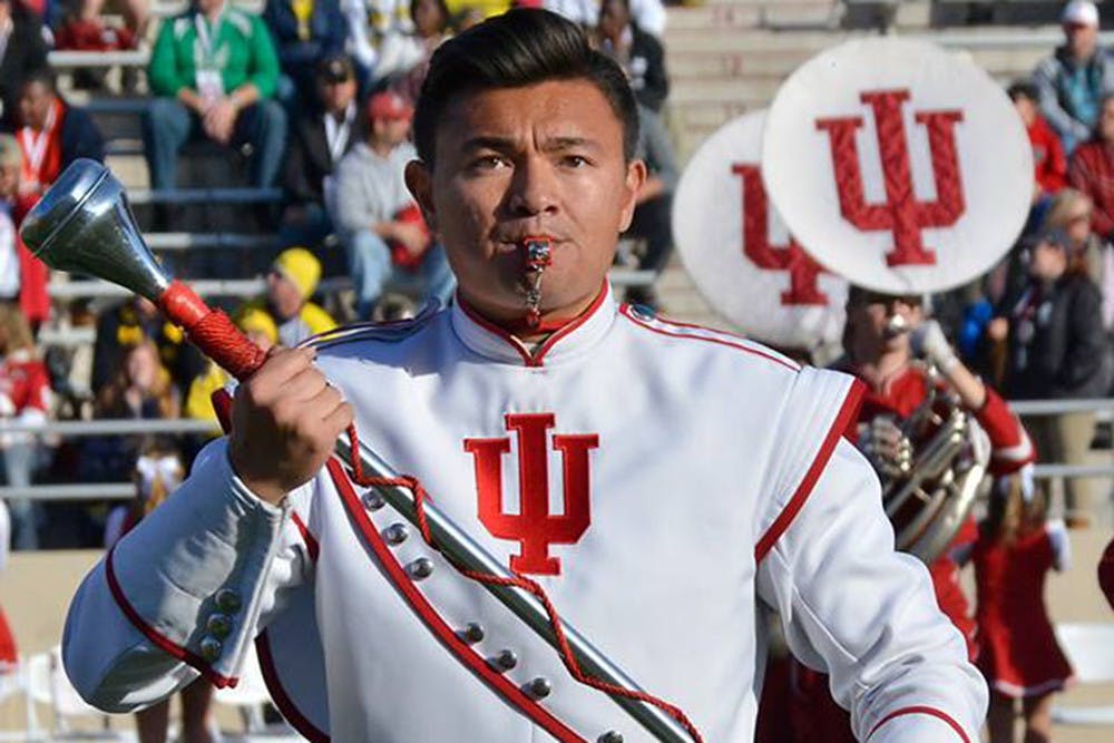 Masters student Bang Co has spent his time as drum major as the face of the Marching Hundred , helping to run rehearsals and lead the band onto the field.