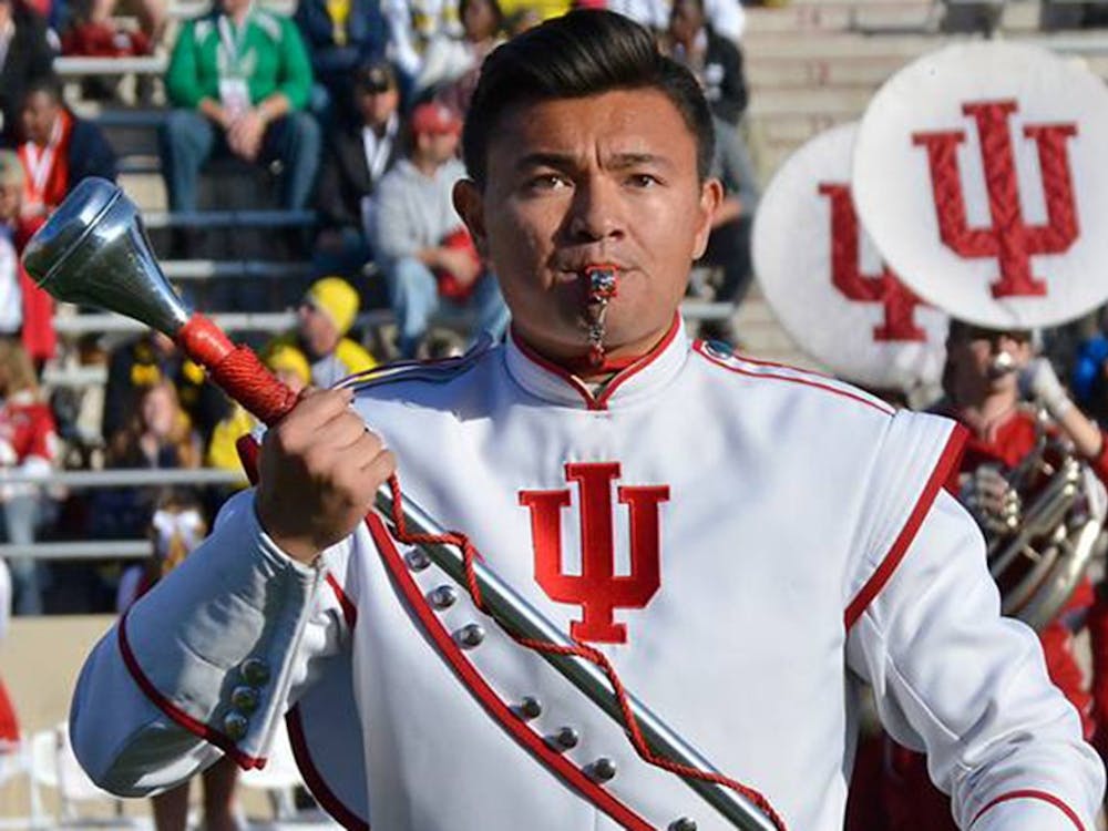 Masters student Bang Co has spent his time as drum major as the face of the Marching Hundred , helping to run rehearsals and lead the band onto the field.