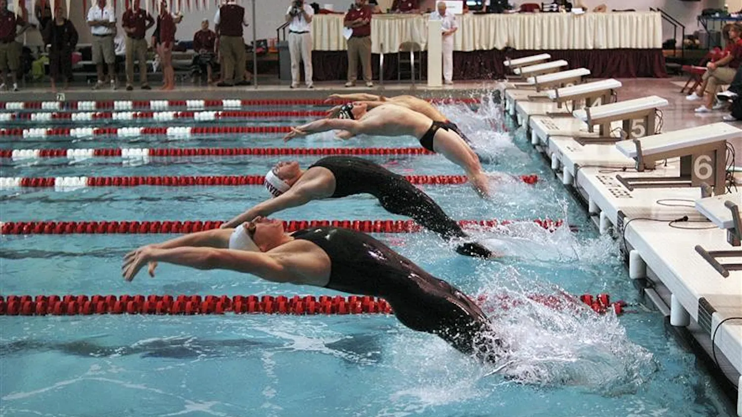 Swimmers launch off the starting block during a backstroke heat on January 17, 2009 at the Counsilman-Billingsley Aquatic Center. IU defeated Ohio State, 163-137, and Missouri, 239-61.