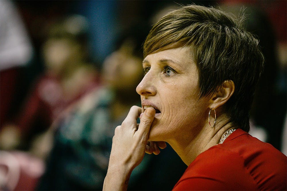 Head coach Teri Moren takes a knee at the edge of the court during the fourth quarter of play on Feb. 4, at Assembly Hall. The Hoosiers held on late to beat the Iowa Hawkeyes 79-74. 