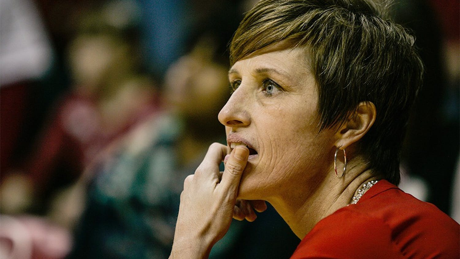 Head coach Teri Moren takes a knee at the edge of the court during the fourth quarter of play on Feb. 4, at Assembly Hall. The Hoosiers held on late to beat the Iowa Hawkeyes 79-74. 