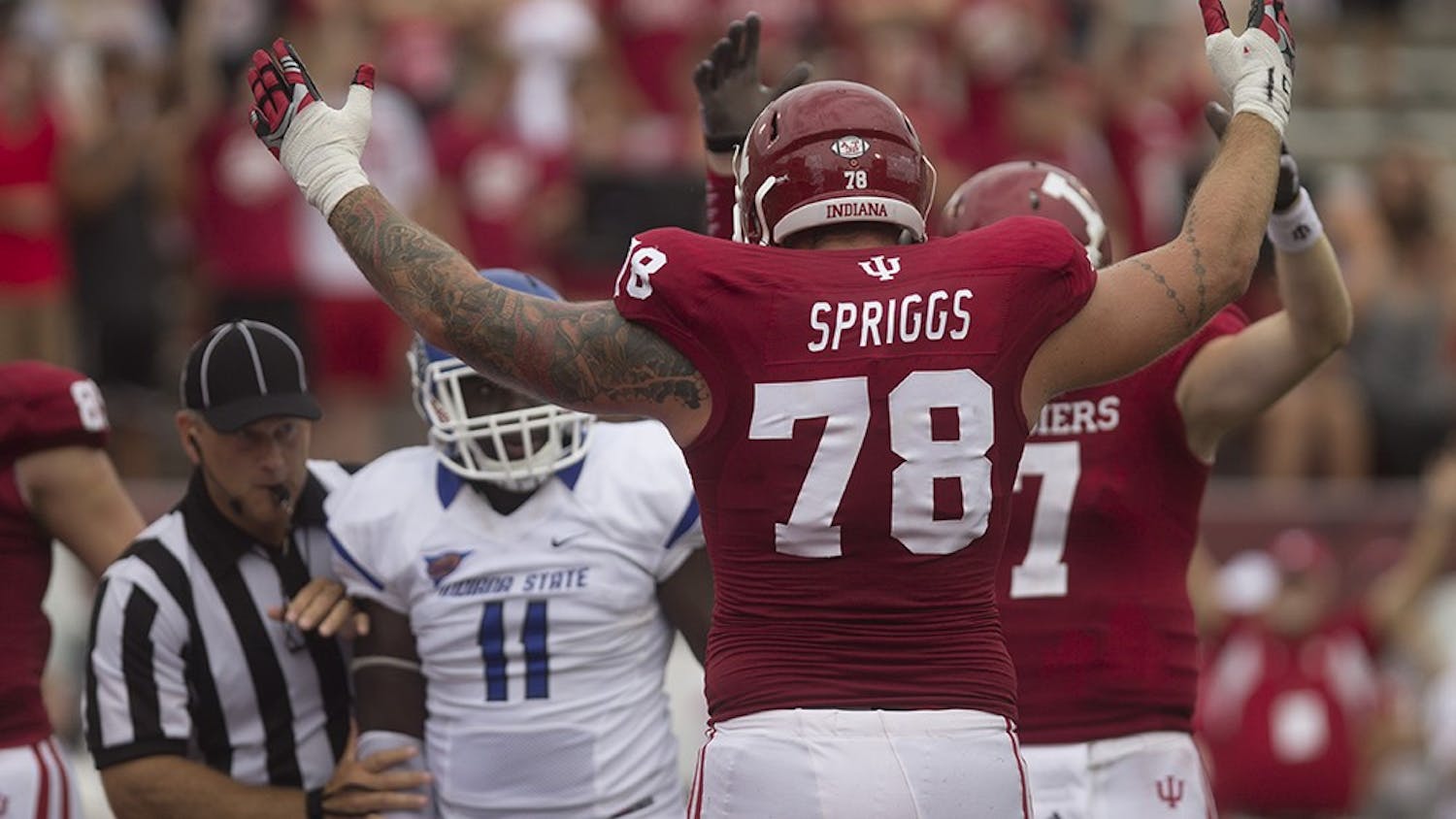 Senior offensive lineman Jason Spriggs celebrates a touchdown during IU's game against Indiana State on Aug. 30, 2014, at Memorial Stadium.