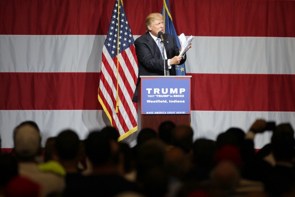 Donald Trump, republican presidential candidate, holds a stack of papers to reference, "all of the lies the Hillary has told," during a Trump rally in Westfield, Ind. on Tuesday evening.