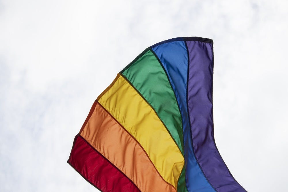 <p>A rainbow Pride flag waves in the wind June 8 at Indy Pride in Indianapolis. Gov. Eric Holcomb signed Senate Bill 480 into law April 5, 2023 which bans gender-affirming care for minors. </p>