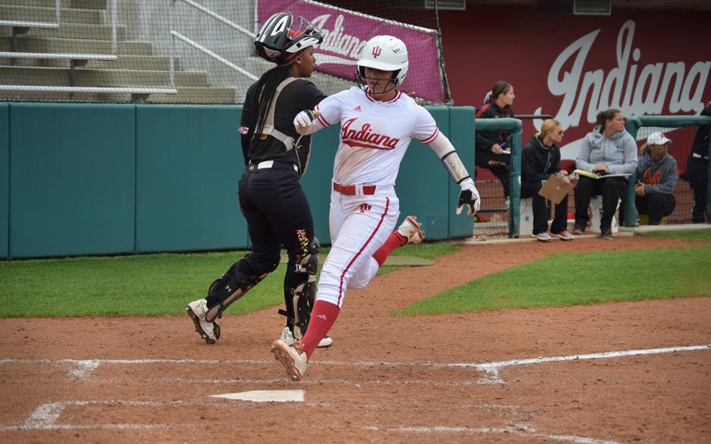 Senior Erin&nbsp;Lehman steps on home plate after an RBI from left fielder Aimilia Mcdonough.  Lehman previously hit a triple to get on base.