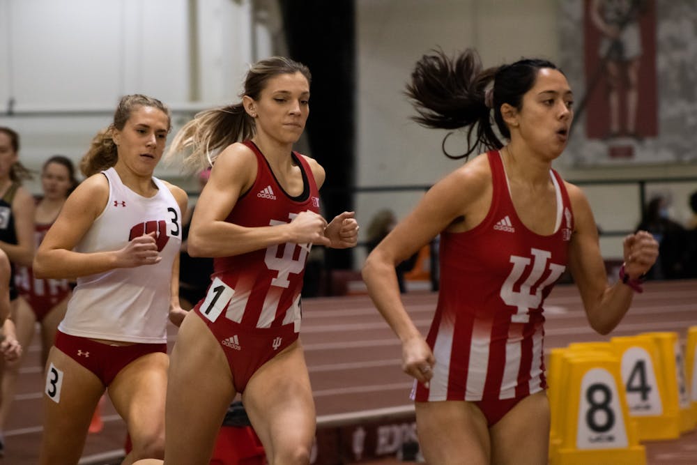 <p>Bailey Hertenstein, middle, wins the mile race at Indiana University Relays Jan. 29, 2022, at Gladstein Fieldhouse. Hertenstein was the only Hoosier to represent Indiana women’s track and field at the NCAA Indoor Track and Field Championships.</p>