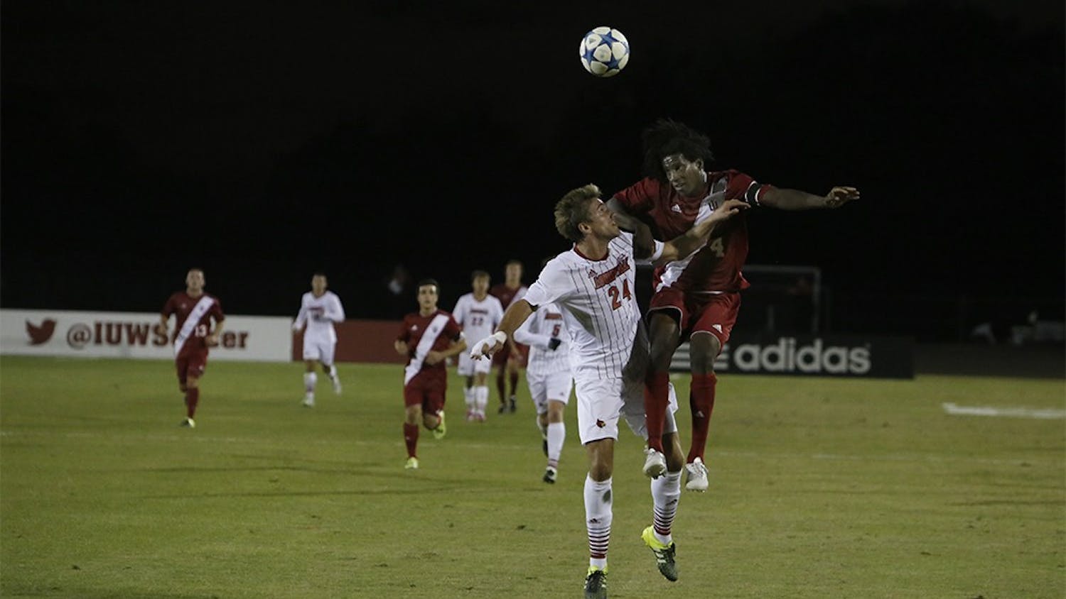 Senior Forward Femi Hollanger-Janzen fights for the ball during IU's game against Louisville Tuesday night at the Bill Armstrong Stadium.