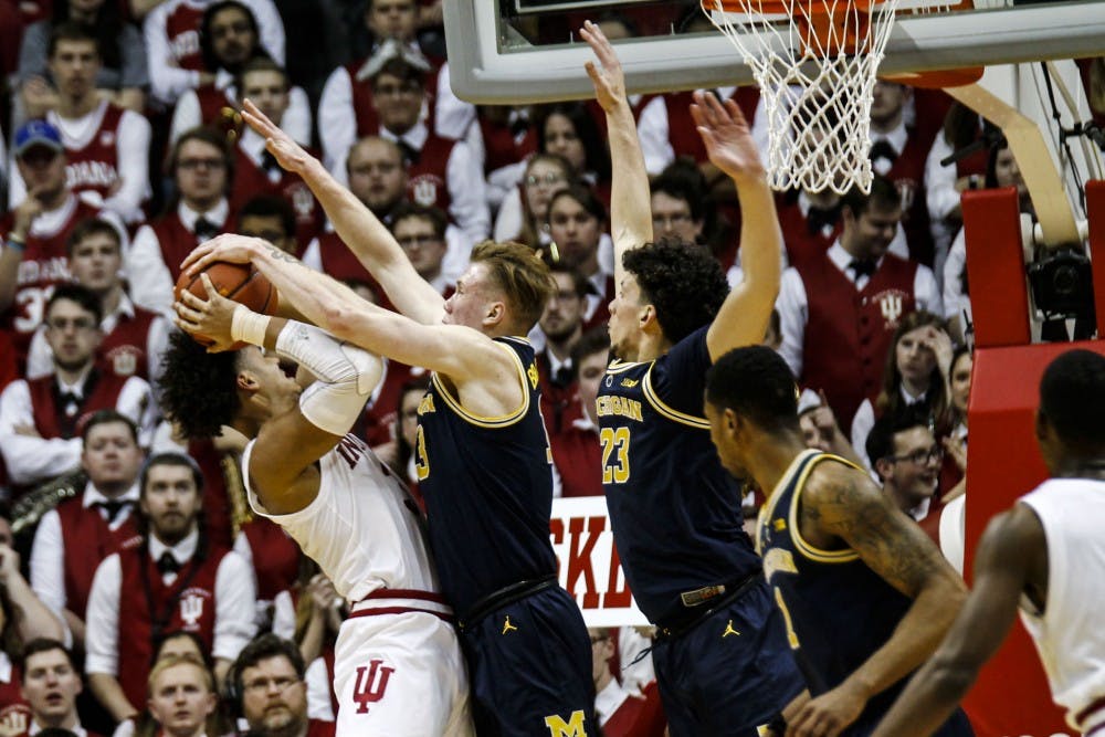 <p>Sophomore forward Justin Smith tries to make a basket, but blocked by a Michigan player on Jan. 25 at Simon Skjodt Assembly Hall. IU lost to Michigan, 69-46.</p>