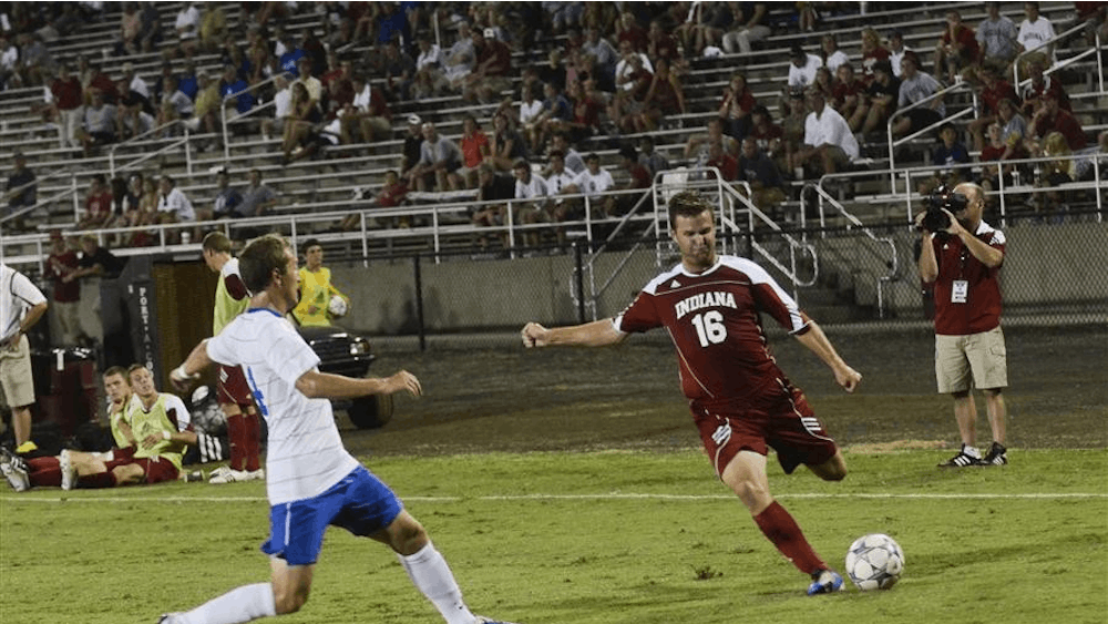 Senior midfielder Tyler McCarroll prepares to send the ball down field during the Hoosier's 3-1 victory against St. Louis on Friday at Bill Armstrong Stadium.