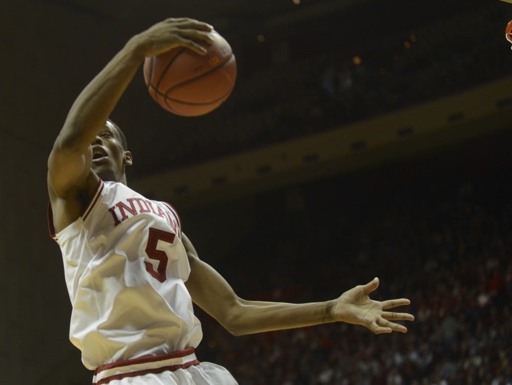 Junior forward Troy Williams grabs the rebound during the game against Northwestern on Saturday at Assembly Hall.