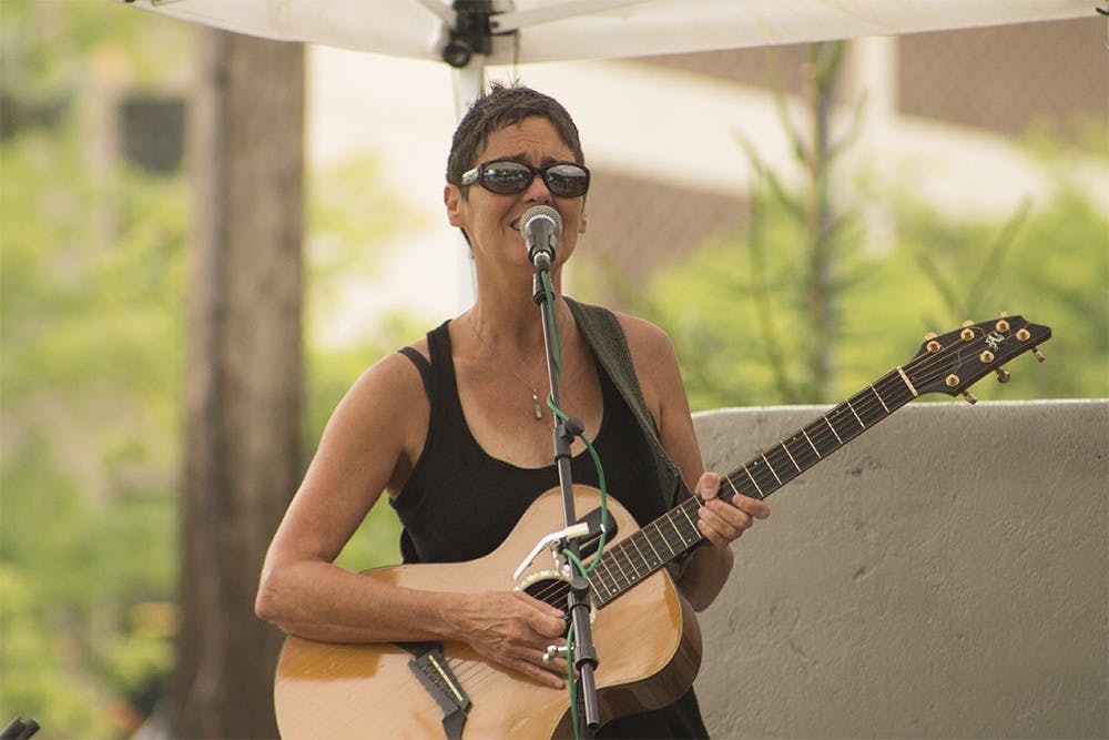 Sharlee Davis performs in People's Park yesterday.
Sharlee Davis performs as part of the free weekly concert series in People's Park on Tuesday. The series will include various artists and run through September.