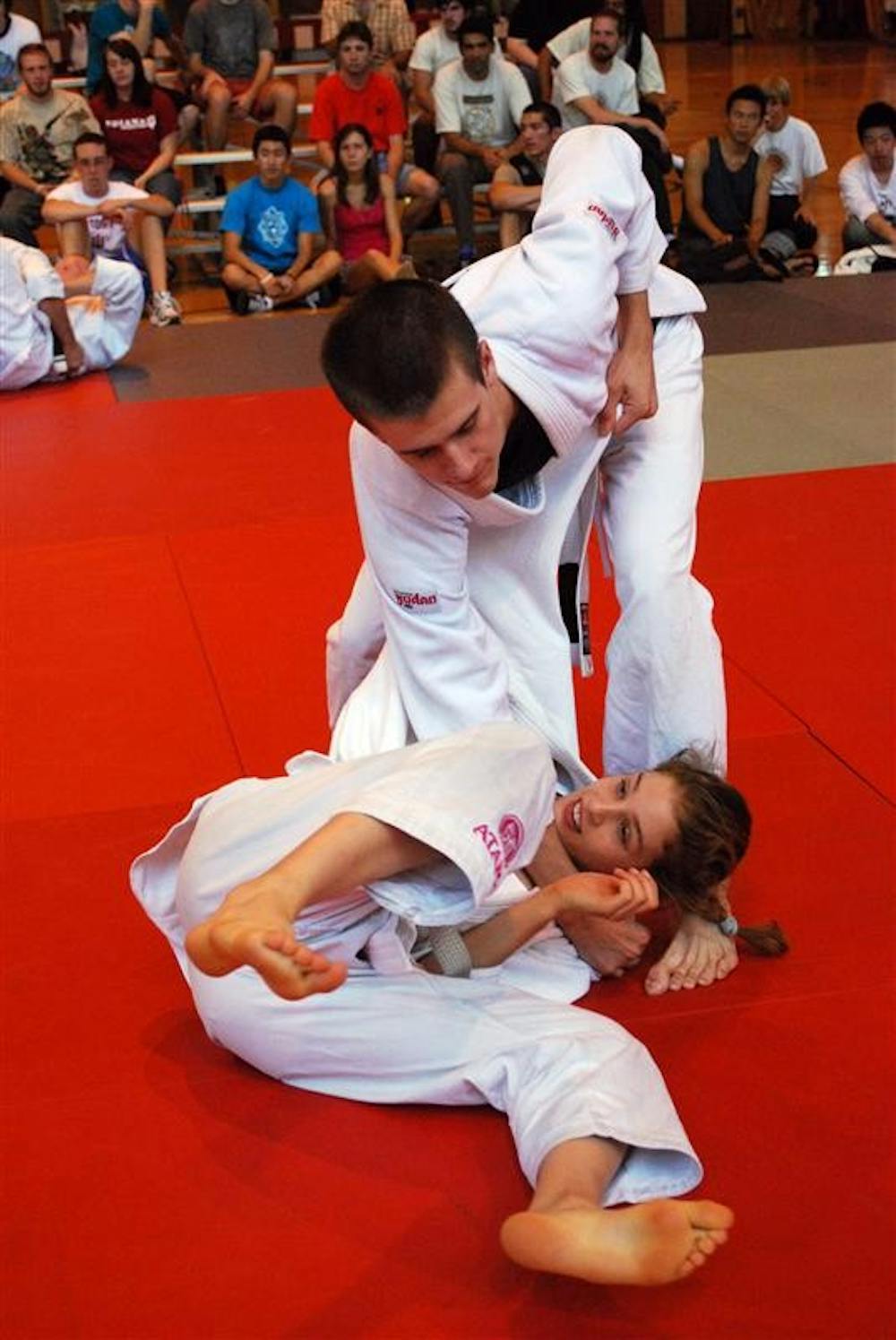 Kimberly Kopecky gets thrown as part of a Brazilian Jiujitsu demonstration Saturday afternoon at the Ora L. Wildermuth Intramural Center.