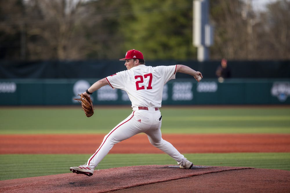 Junior Brooks Ey pitches the ball April 7, 2023, at Bart Kaufman Field. Indiana won its weekend series against Illinois with a doubleheader sweep on Saturday.