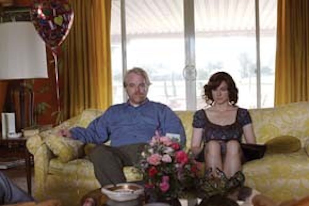 Laura Linney wants the balloon, but Philip Seymour Hoffman wants all the joy to himself.