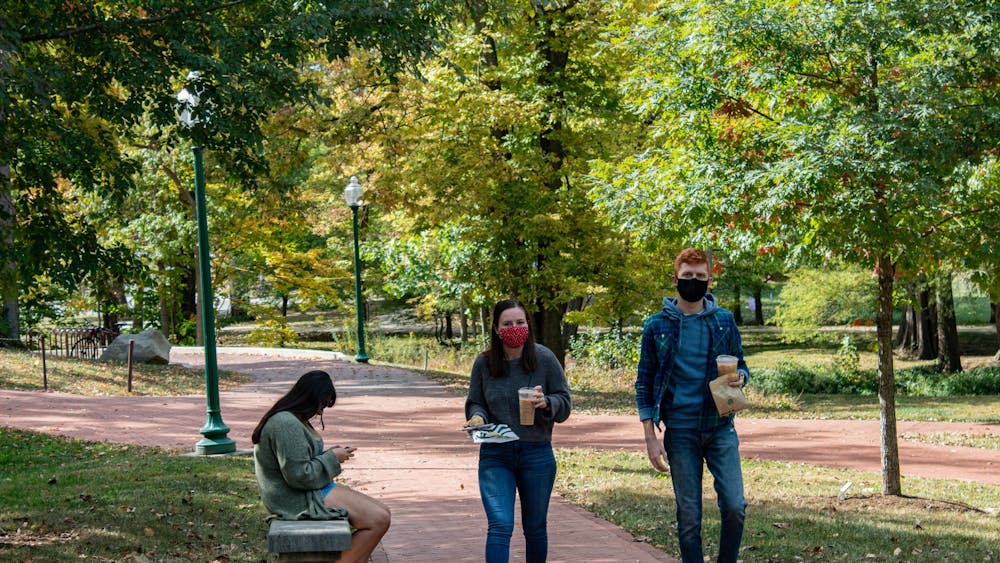 Students walk along a trail Oct. 15, 2020, by the Campus River near Dunn Meadow. A new IU study will test COVID-19 infection and transmission among vaccinated college students and is in need of 12,000 college students from various universities to participate. 