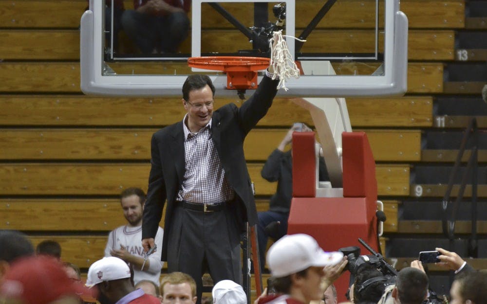 Head Coach Tom Crean holds the net after finishing the regular season on Sunday, March 6, 2016 at the Assembly Hall. 