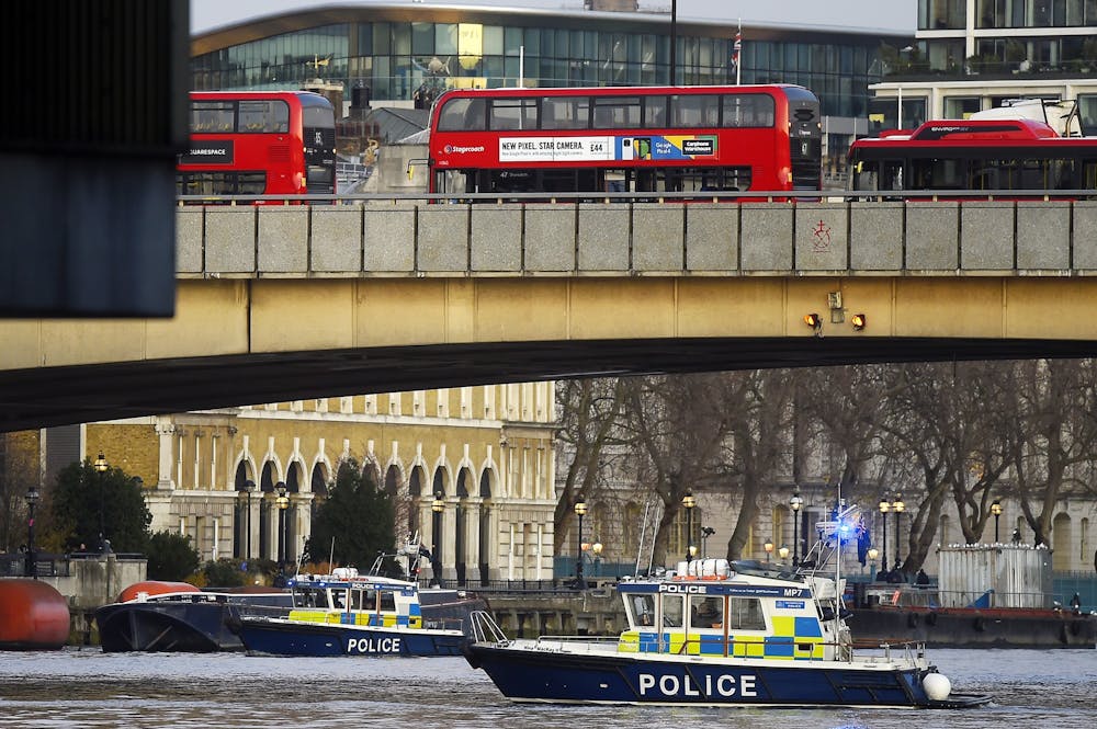 Boats from the Metropolitan Police Marine Policing Unit patrol near the scene after people were reported injured during a stabbing on London Bridge on Nov. 29 in London, England. Police said they were called to the stabbing around 2 p.m. 