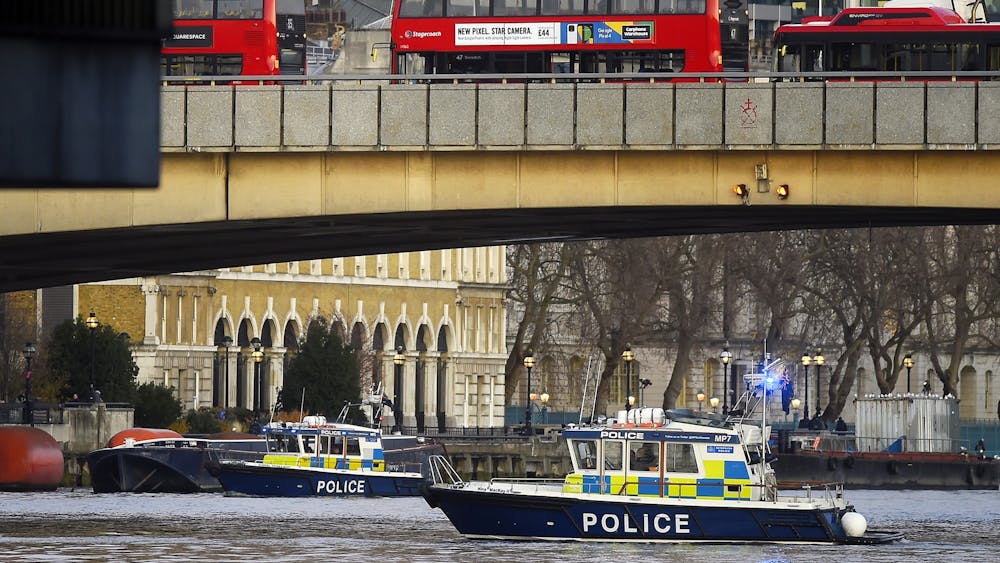 Boats from the Metropolitan Police Marine Policing Unit patrol near the scene after people were reported injured during a stabbing on London Bridge on Nov. 29 in London, England. Police said they were called to the stabbing around 2 p.m. 