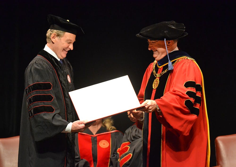 President McRobbie presents Kevin Kline with an Honorary Degree Monday at the IU Auditorium.