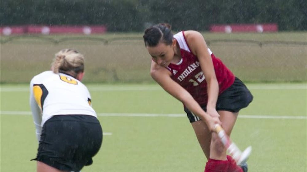 Iowa Hawkeyes’ freshman Corinne Allen blocks a pass attempted by IU junior Danielle McNally on Friday at the IU Field Hockey Complex. IU lost the match 1-2 in overtime.