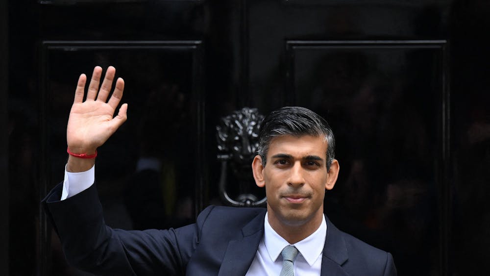 Britain&#x27;s newly appointed Prime Minister Rishi Sunak waves after delivering his first speech as prime minister Oct. 25, 2022, at 10 Downing St. in central London.