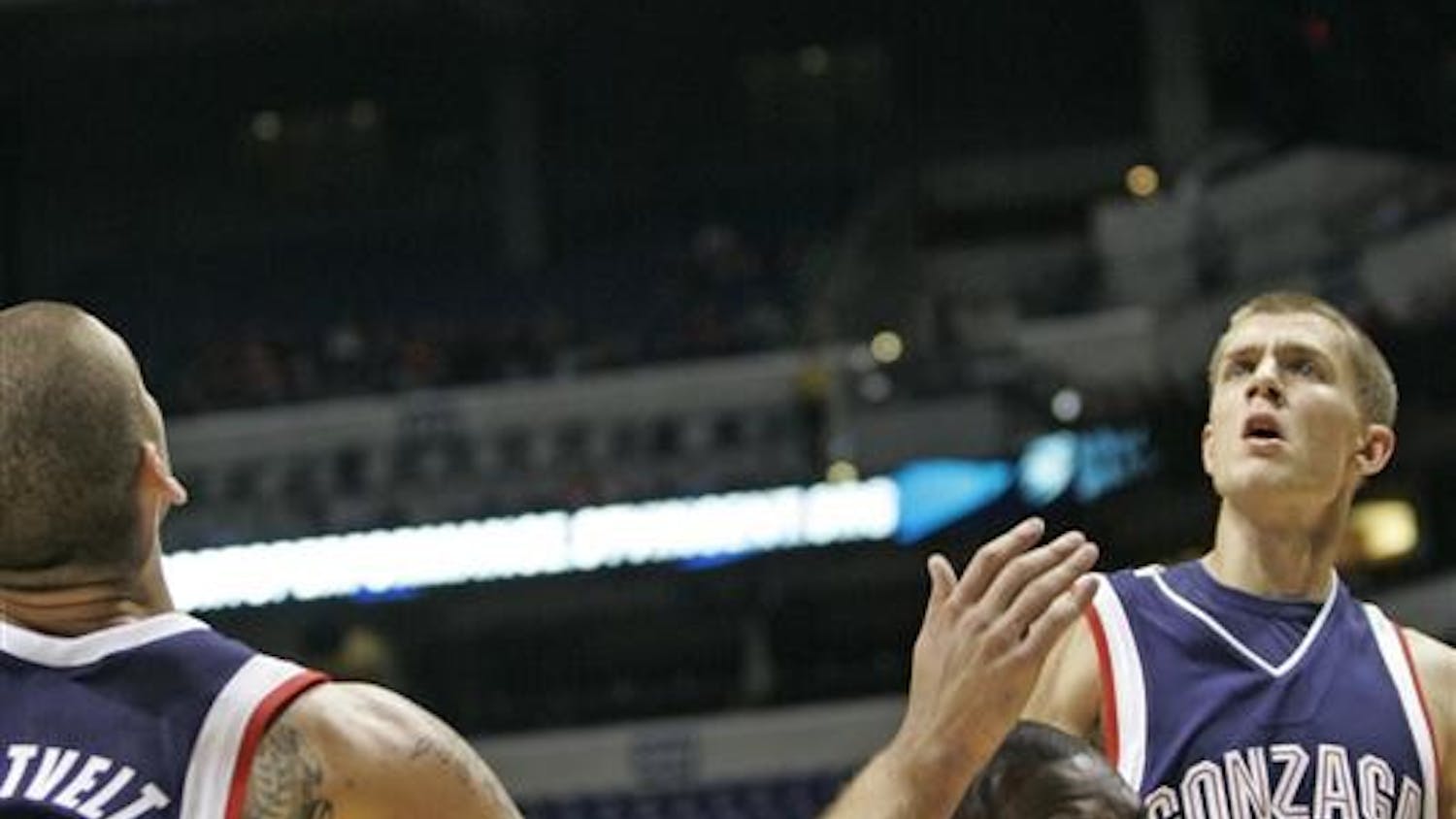Freshman guard/forward Malik Story loses his balance as the ball comes loose during IU's 70-54 loss to Gonzaga on Saturday at Lucas Oil Stadium.